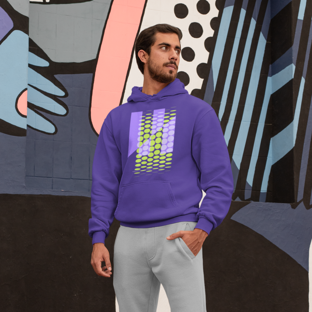 Abstract patterns A man in a purple hoodie with an abstract print standing in front of a graffiti.