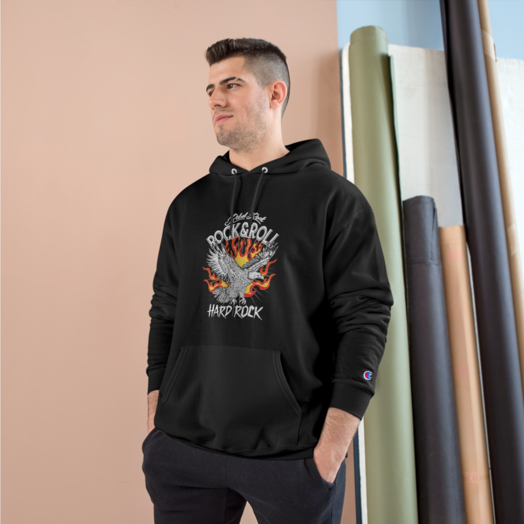 Champion hoodie A man in a black hoodie with a “Rock&Roll”, an illustrated eagle, and a “Hard Rock” print.