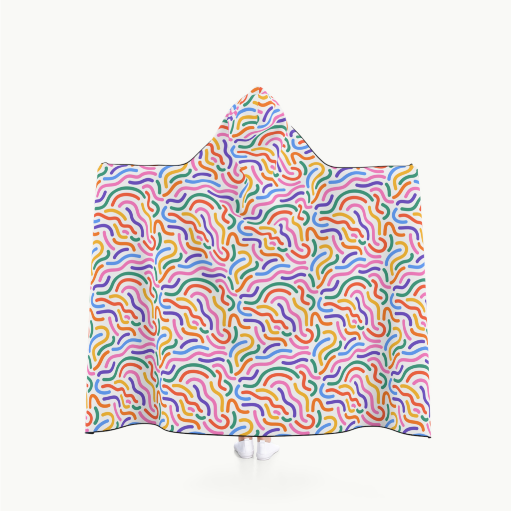Soft Hooded Blanket A person wearing a custom hooded blanket with an abstract all-over-print on the backside.