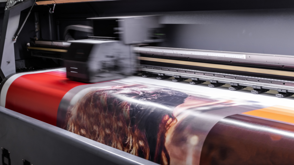 What Exactly Is a Print A printing machine printing a poster.